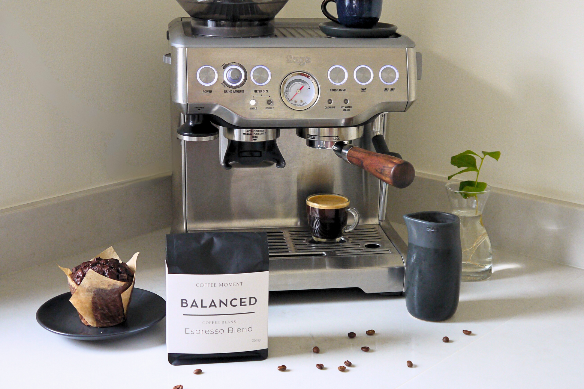 Espresso machine with a bag of Balanced Coffee Blend on a countertop.